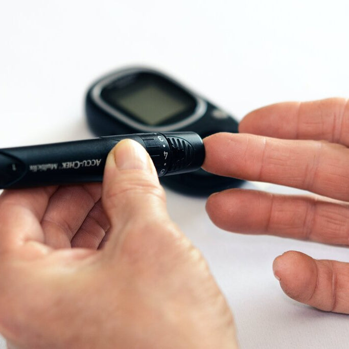 person measuring their blood sugar